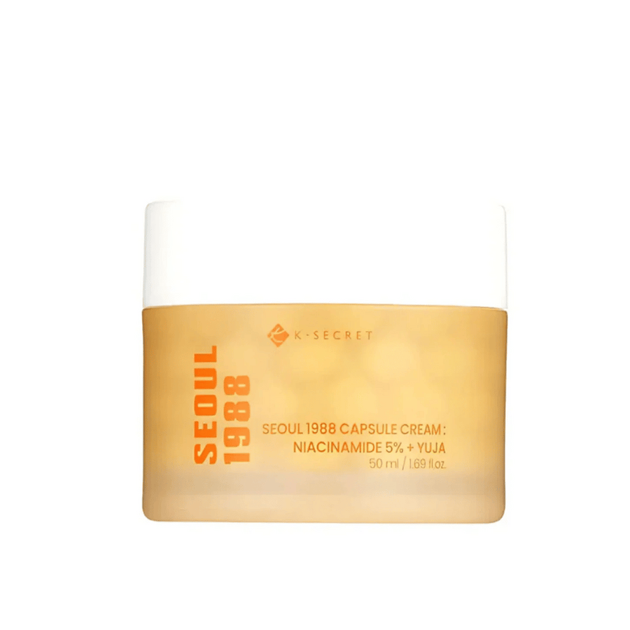Burk med K-Secret Seoul 1988 Capsule Cream Niacinamide 5% + Yuja, 50 ml, i guldfärgat designat emballage.