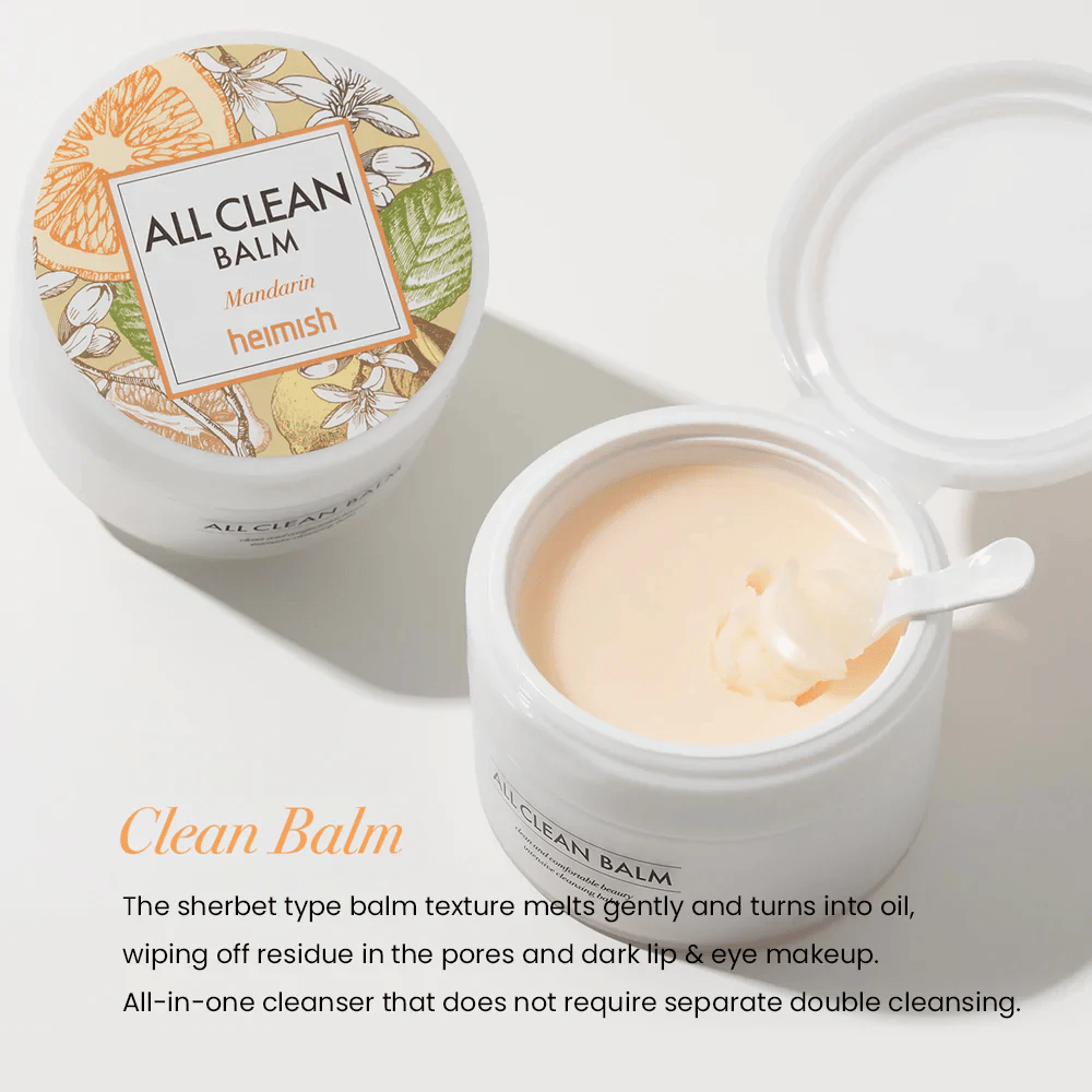 Otwarty słoik Heimish All Clean Balm Mandarin z łyżką mieszającą kremowy balsam oczyszczający, z kolorową etykietą i napisem 'Clean Balm' na pierwszym planie.