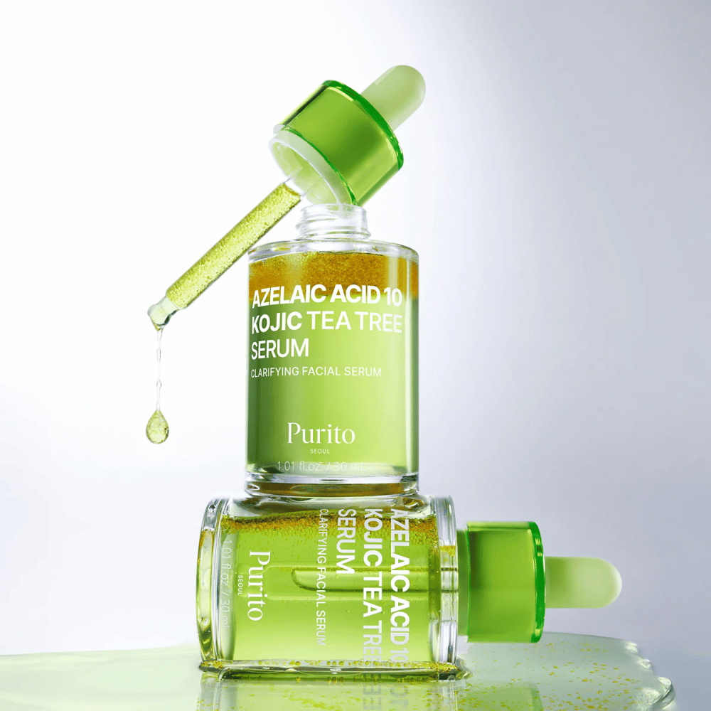 Purito Azelaic Acid 10 Kojic Tea Tree Serum – świeża zielona formuła z kroplą z pipety pokazującą lekką teksturę serum.