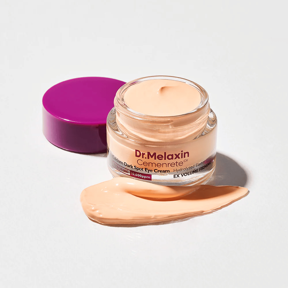 Dr.Melaxin Cemenrete Calcium Dark Spot Eye Cream w otwartym słoiku z kremową teksturą, krem pod oczy, który pomaga redukować cienie i ujędrniać skórę wokół oczu.