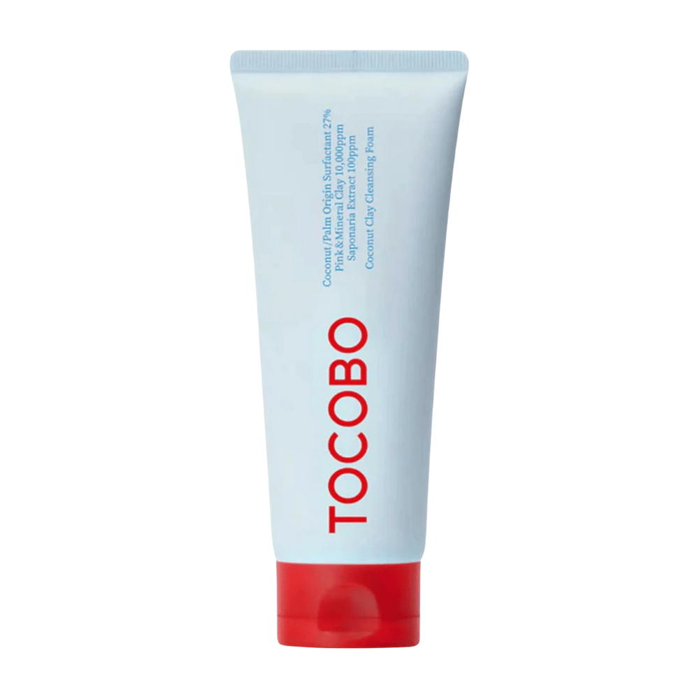 Tuba TOCOBO Coconut Clay Cleansing Foam jest widoczna. Tuba jest jasnoniebieska z czerwoną nakrętką i napisem "TOCOBO" dużymi literami z przodu. Produkt jest opisany jako pianka czyszcząca z gliny kokosowej i zawiera naturalne składniki.