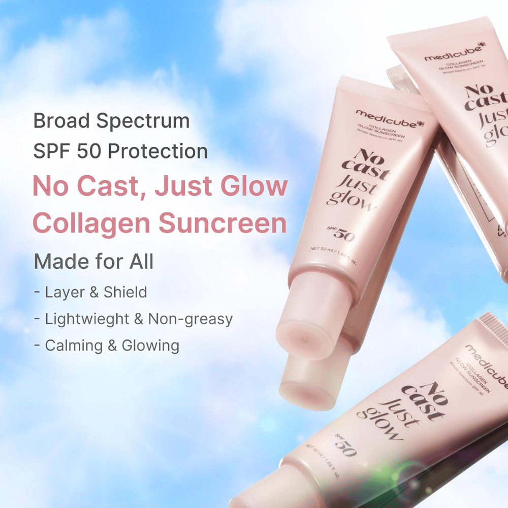 Medicube Collagen Glow Sunscreen SPF 50, lekki krem przeciwsłoneczny z efektem glow bez białego nalotu. Różowe tubki kremu przeciwsłonecznego na tle błękitnego nieba.