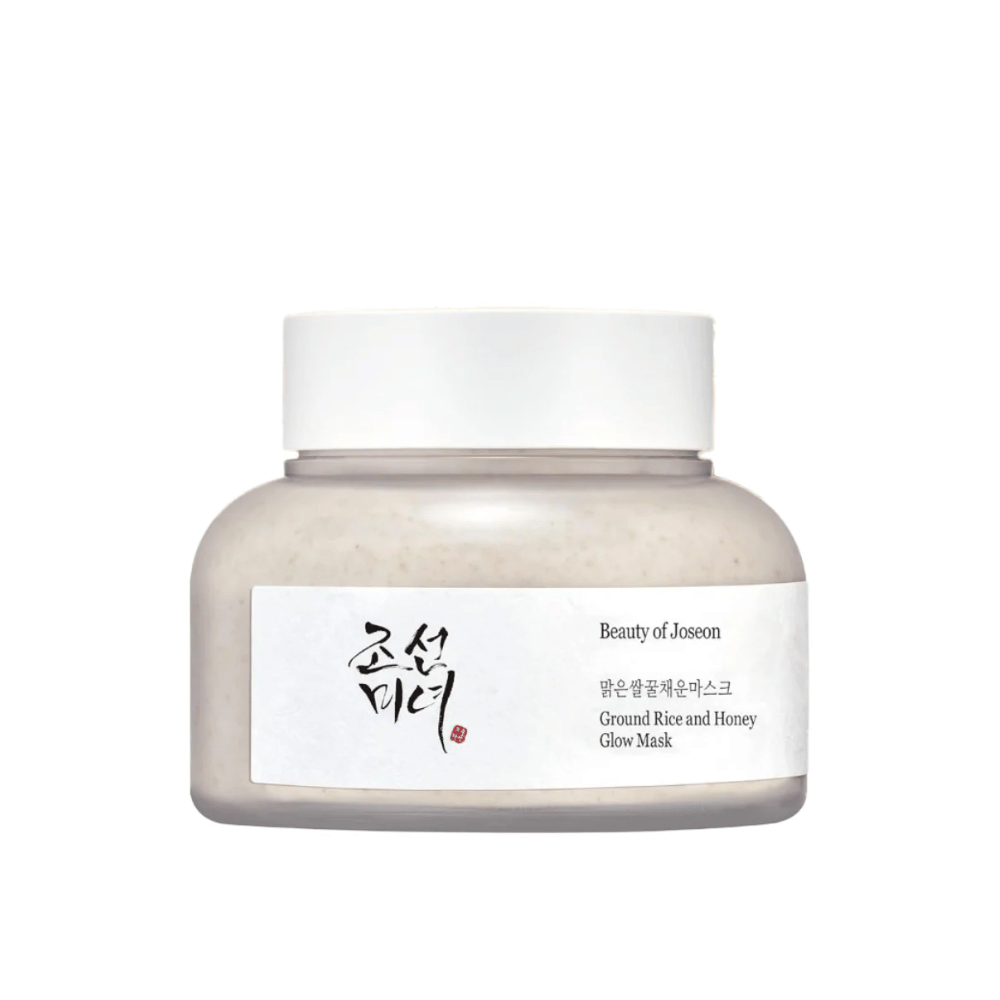 Słoik "Beauty of Joseon Ground Rice and Honey Glow Mask". Opakowanie jest proste z białym korkiem i etykietą prezentującą nazwę produktu i składniki zarówno po koreańsku, jak i angielsku. Produkt jest zaprojektowany, aby dodać blasku i odżywienia skórze.