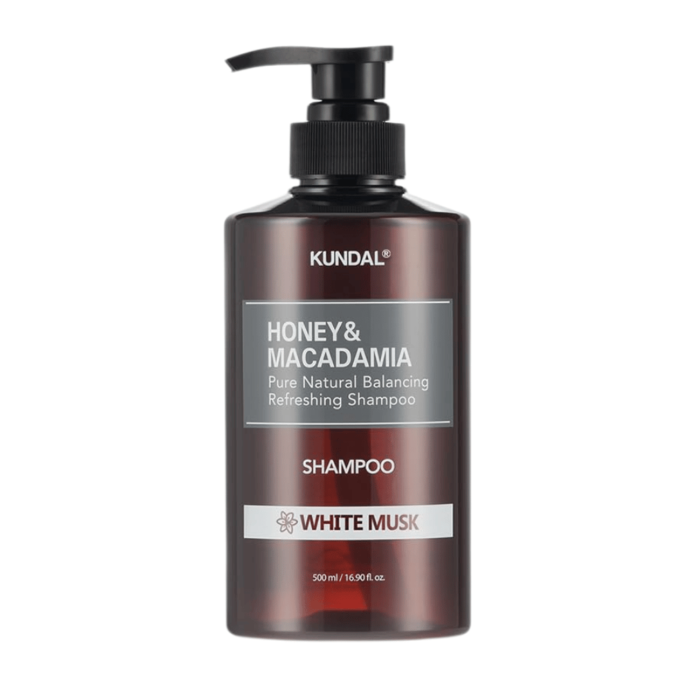 KUNDAL Honey & Macadamia Nature Shampoo White Musk w brązowej plastikowej butelce z pompką, 500 ml.