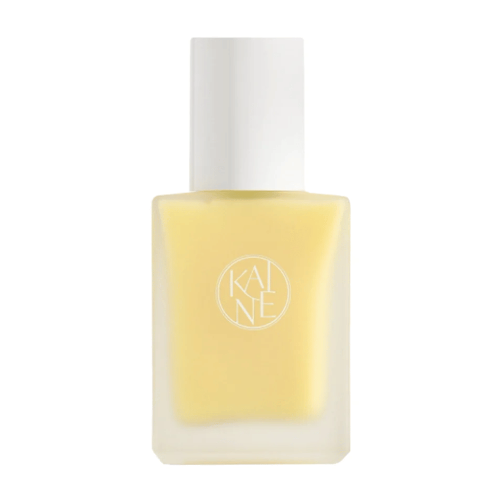 Żółta Vita Drop Serum 30ml butelka na białym tle z KAINE produktami do pielęgnacji skóry.