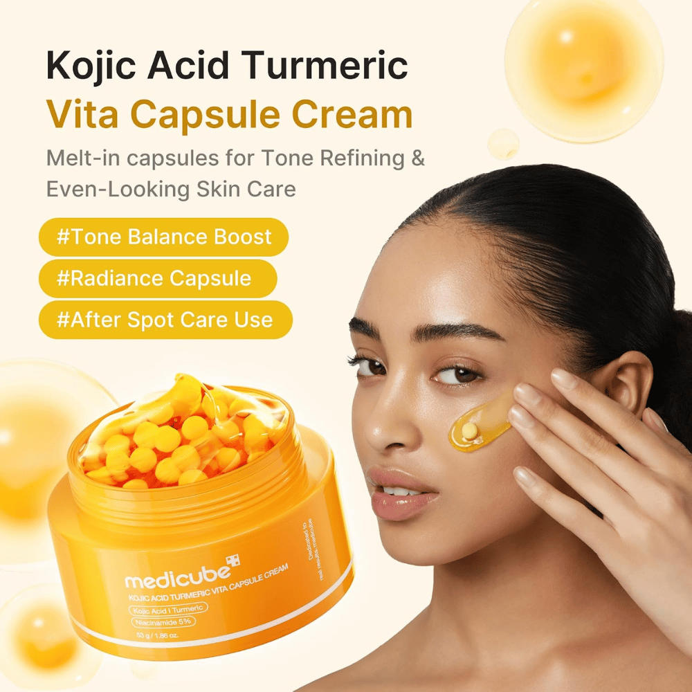 4. Medicube Kojic Acid Turmeric Vita Capsule Cream – rozświetlający krem do twarzy z kapsułkami nakładany na policzek