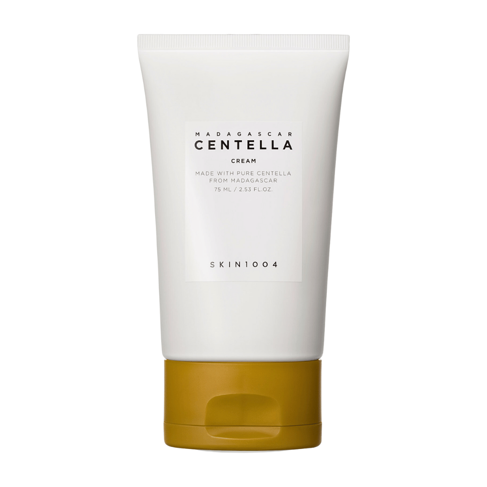 Obrazek przedstawia tubkę z "Madagascar Centella Cream" od SKIN1004. Jest to krem do skóry wyprodukowany z czystej Centelli z Madagaskaru i dostępny w opakowaniu o pojemności 75 ml / 2.53 fl.oz. Produkt przeznaczony jest do pielęgnacji skóry, aby dostarczać jej składników odżywczych i nawilżenia.