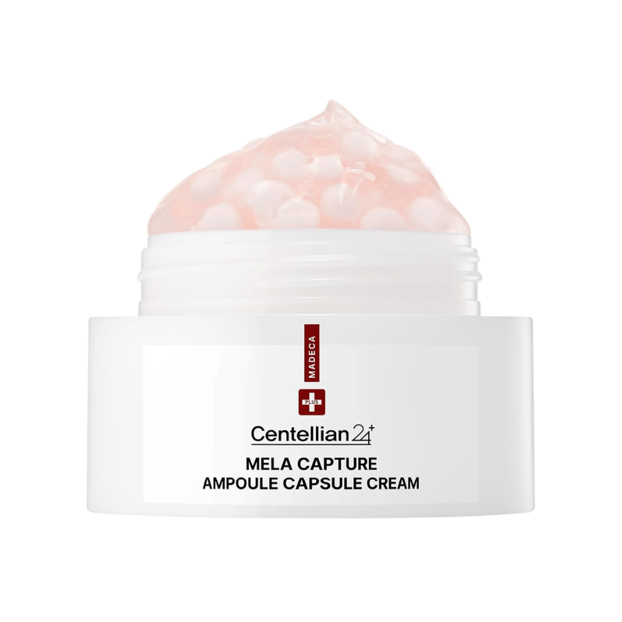 Zbliżenie na Centellian24 Madeca Mela Capture Ampoule Capsule Cream, pokazujące różowy krem-żel z zamkniętymi w kapsułkach kulkami ampułki w słoiczku.