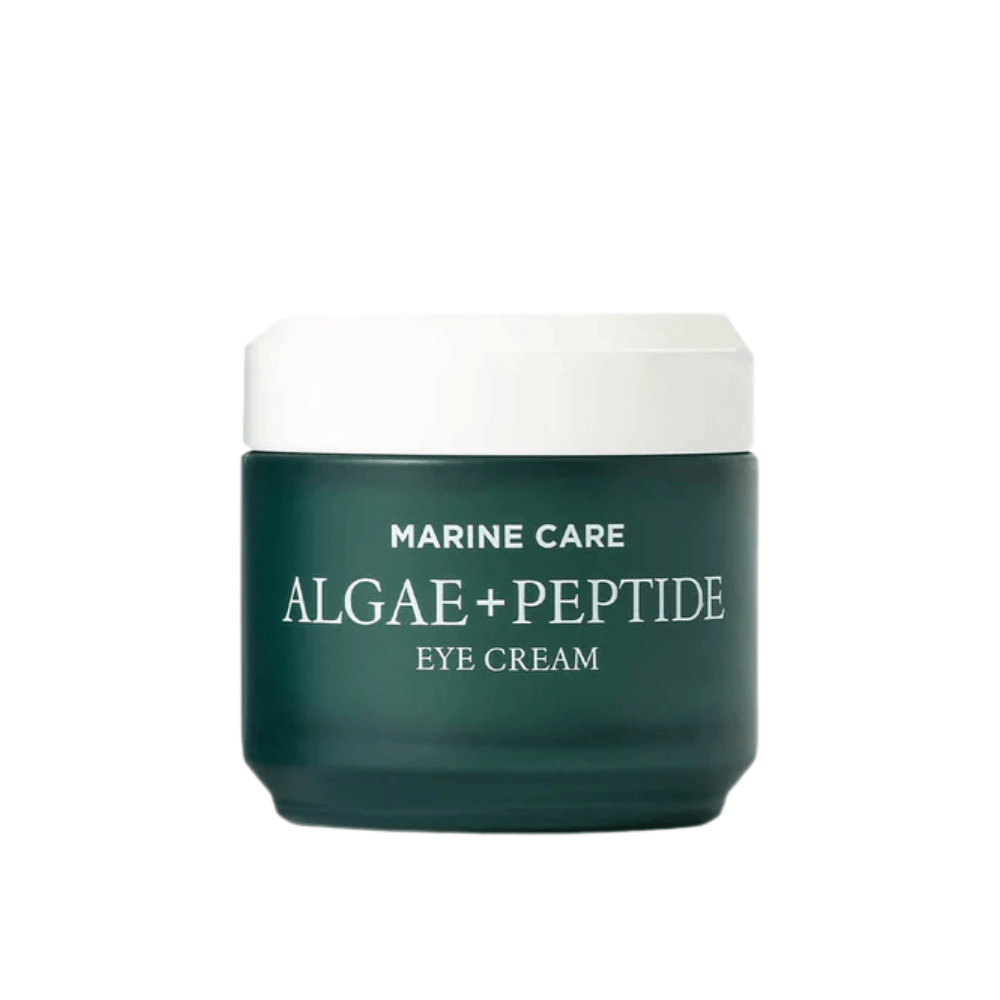 Heimish Marine Care Algae + Peptide Eye Cream w ciemnozielonym słoiku z białą pokrywką. Krem pod oczy wzbogacony algami i peptydami, aby nawilżać, rozjaśniać i redukować drobne zmarszczki wokół oczu.