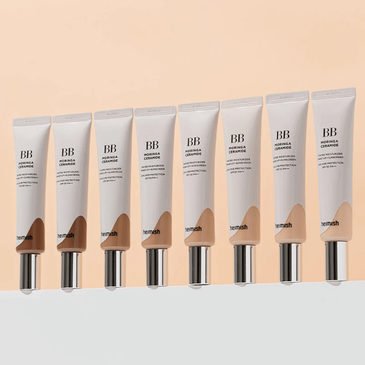 Rząd Heimish Moringa Ceramide BB Cream w kilku odcieniach kolorystycznych. Obraz ilustruje przejście od jaśniejszych do ciemniejszych tonik do twarzy, aby dopasować się do różnych odcieni skóry i potrzeb.
