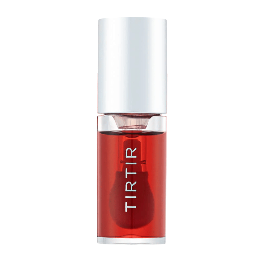 TIRTIR My Glow Lip Oil w przezroczystym czerwonym odcieniu z srebrną nakrętką, pokazany prosto z przodu na białym tle.