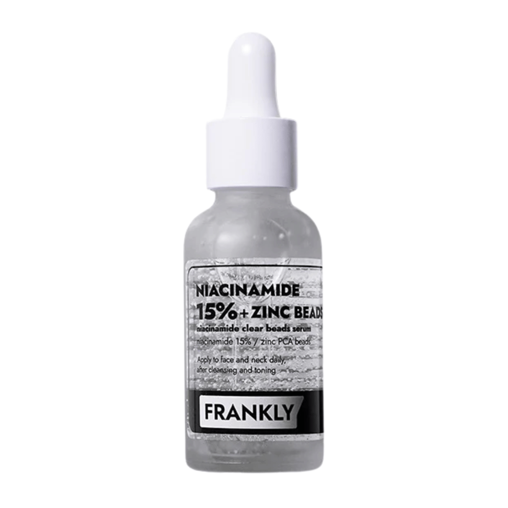 Obraz produktu FRANKLY Niacinamide 15% + Zinc Beads Serum w szklanej butelce z pipetą. Serum, które balansuje, łagodzi i poprawia klarowność skóry.