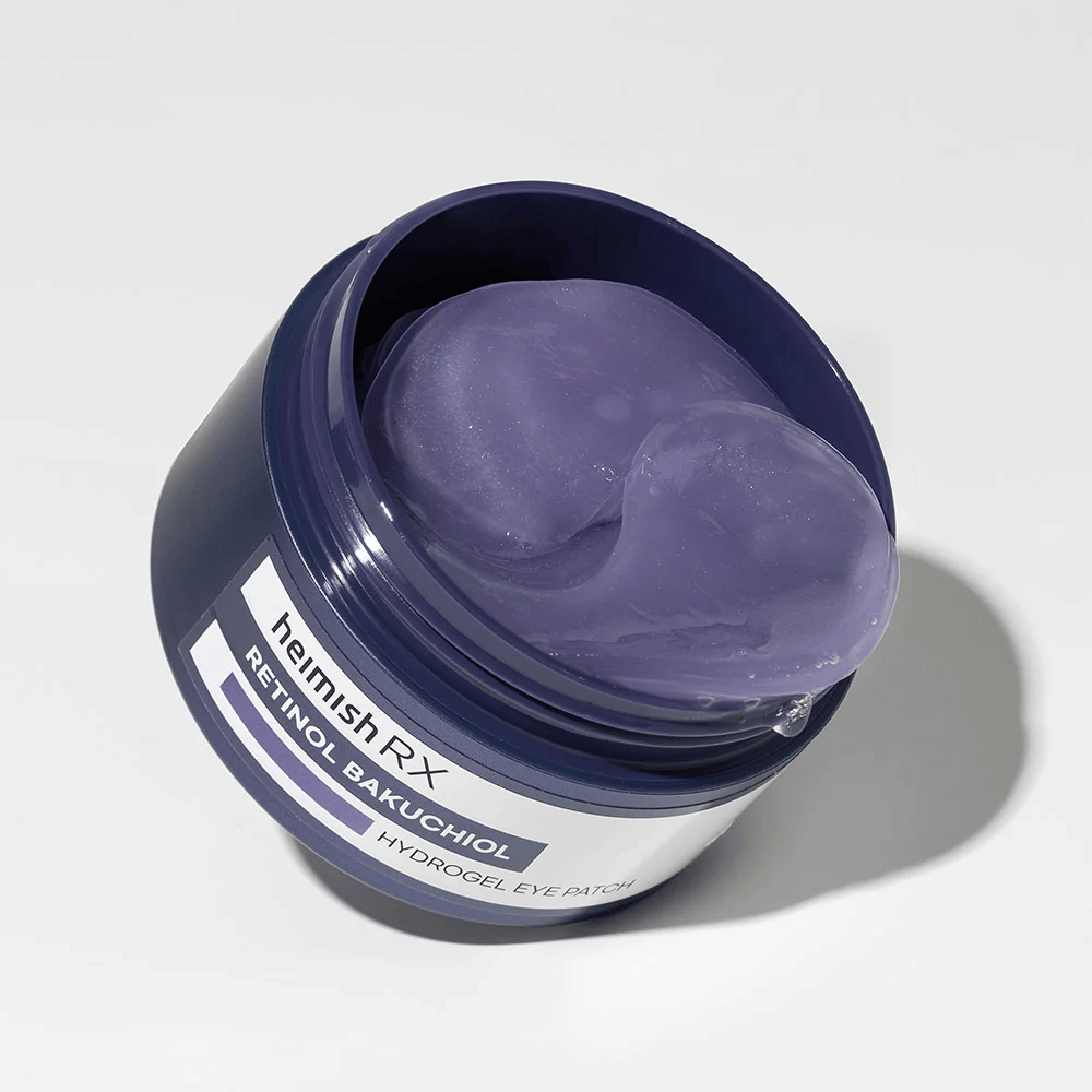 Heimish RX Retinol Bakuchiol Hydrogel Eye Patch w ciemnoniebieskim słoiku z fioletowymi hydrożelowymi płatkami pod oczy. Produkt zaprojektowany do nawilżania i redukcji drobnych linii wokół oczu.