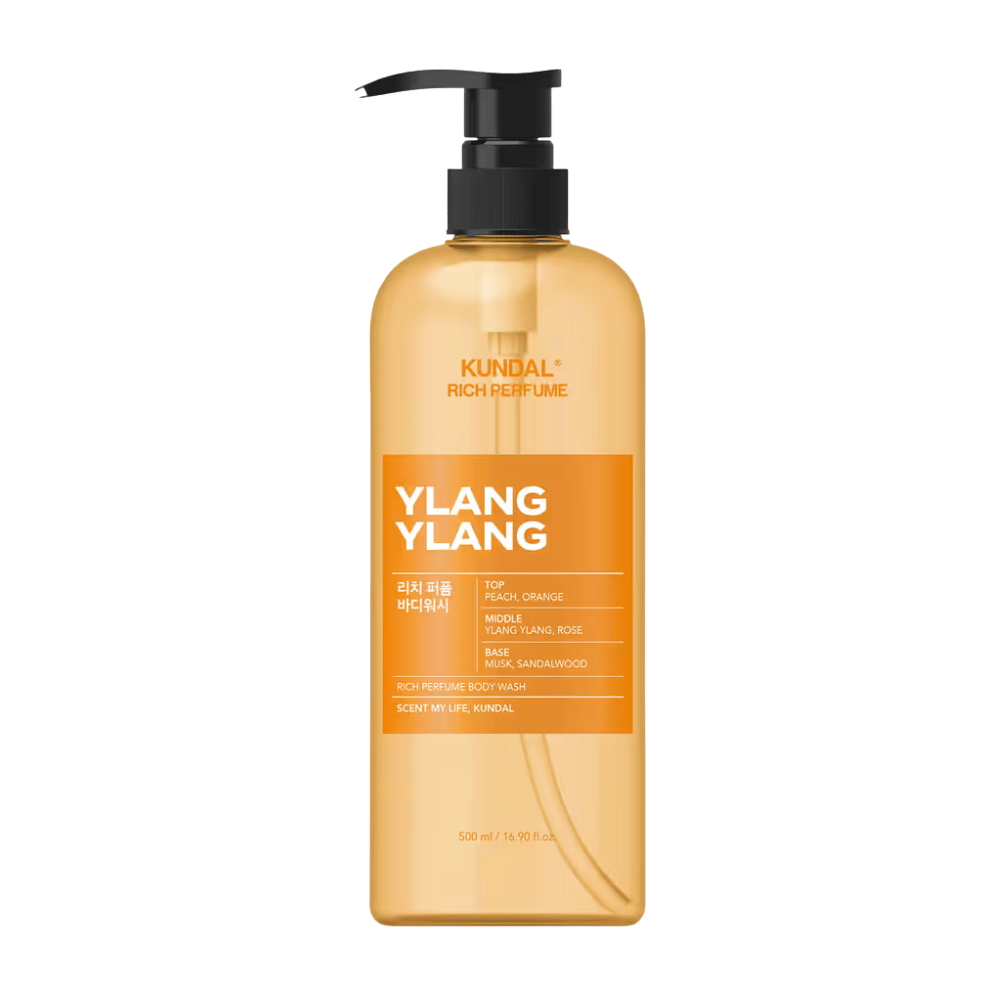 6. KUNDAL Rich Perfume Body Wash Ylang Ylang 500 ml – pomarańczowy żel pod prysznic z pompką