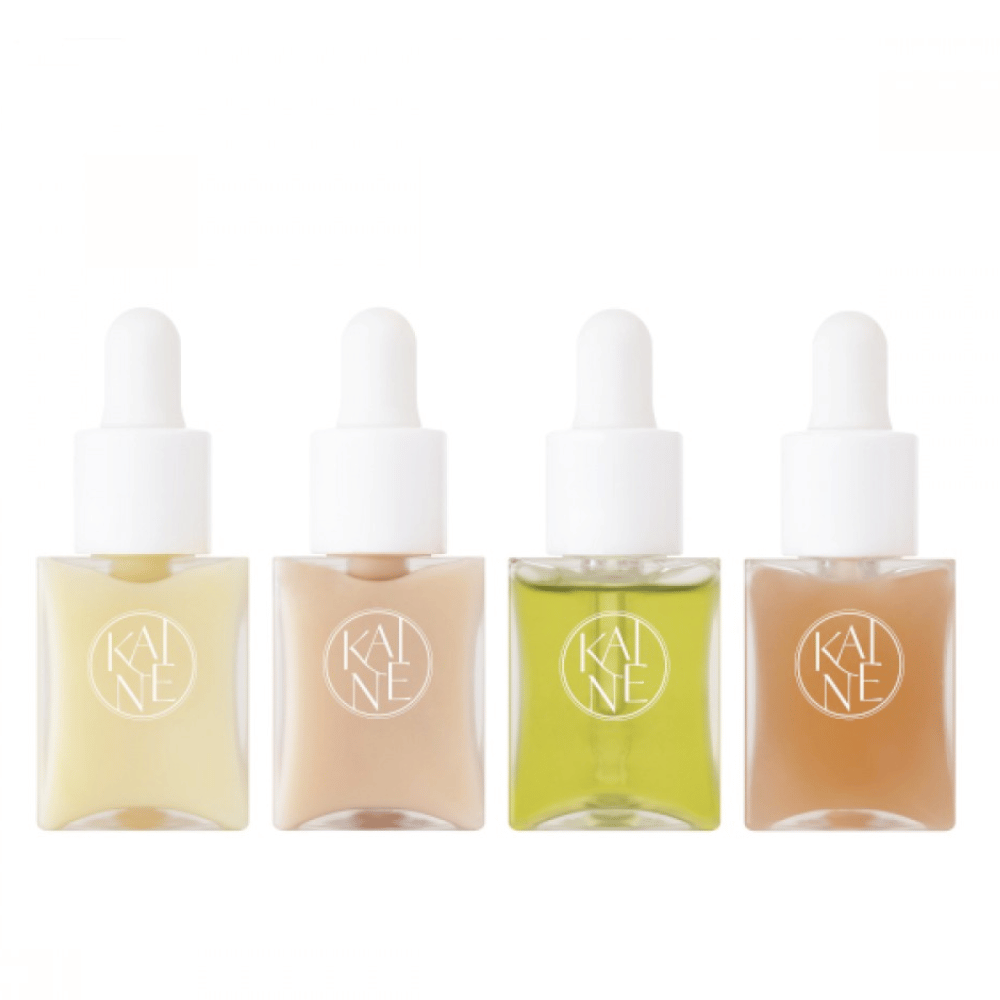 Cztery kolorowe butelki z serum od KAINÉ Serum Discovery Kit z pipetą, zaprojektowane, aby sprostać różnym potrzebom skóry w minimalistycznym i eleganckim opakowaniu.