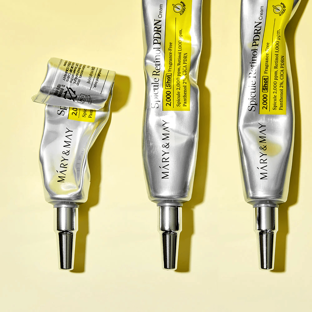 MARY & MAY Spicule Retinol PDRN Cream z widocznym użyciem w tubie, pokazuje konsystencję kremu i precyzyjny aplikator do dokładnej aplikacji na skórę.