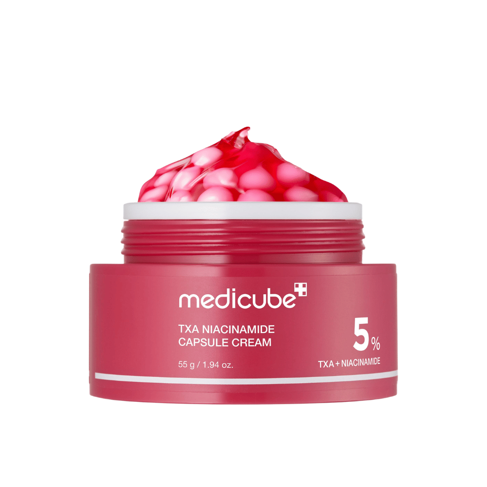 Medicube TXA Niacinamide Capsule Cream w słoiku z różowymi kapsułkami w formie żelu, z wyraźnym oznaczeniem produktu 5% TXA + Niacynamid.