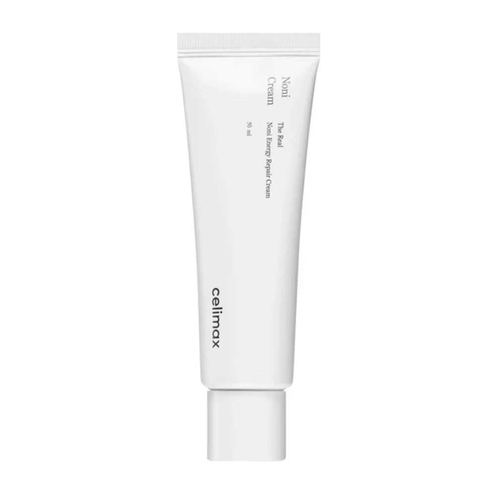 Celimax Noni Energy Repair Cream w białej tubce z czarnym napisem. Produkt jest oznaczony jako "The Real Noni Energy Repair Cream" i ma objętość 50 ml.