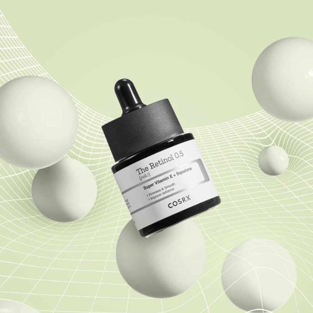 Butelka COSRX Retinol 0.5 Oil 20ml, która wspomaga działanie przeciwstarzeniowe na białym tle.
